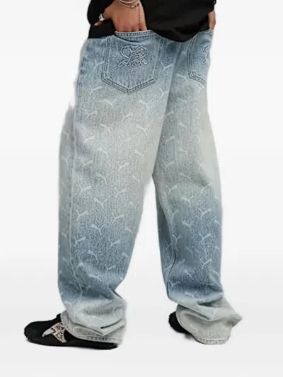 Puma Laser Monogram Denim Jeans In Blue