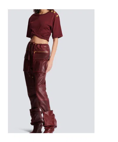 Balmain Twisted Button-embellished Top In Burgundy