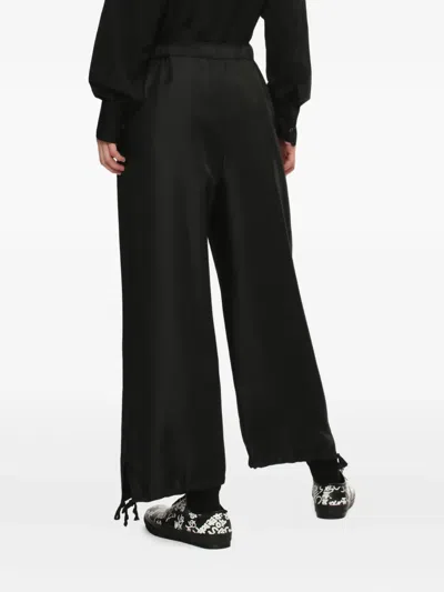 Comme Des Garçons Polyester Elastic Hem Pants In Black