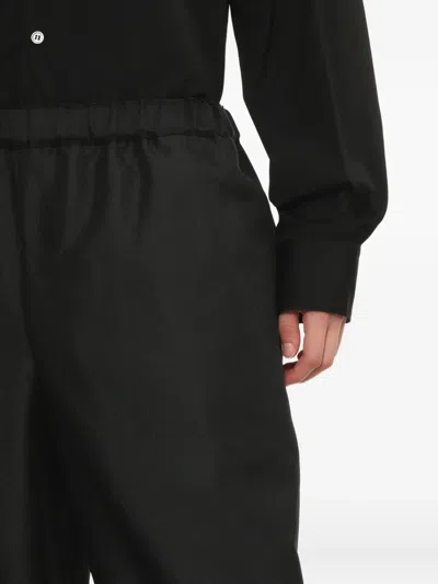 Comme Des Garçons Polyester Elastic Hem Pants In Black