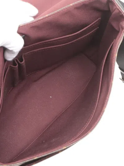 Pre-owned Louis Vuitton 2013 Monogram Macassar District Mm Crossbody Bag In Brown