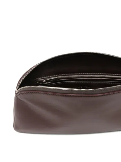 The Row Logo-debossed Pouch In Burgundy
