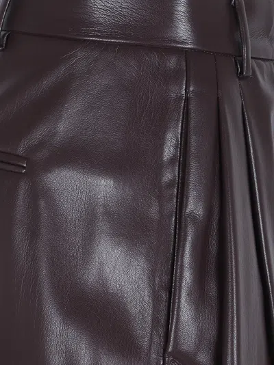 The Andamane Maxi Flare Vegan Leather Trousers In Brown