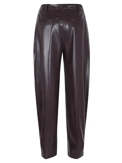 The Andamane Maxi Flare Vegan Leather Trousers In Brown