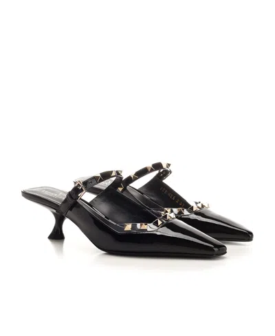Valentino Rockstud Asymmetric Patent-leather Mules In Black