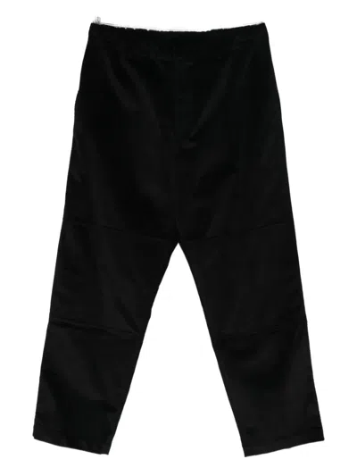 State Of Order Panelled Trousers In Black
