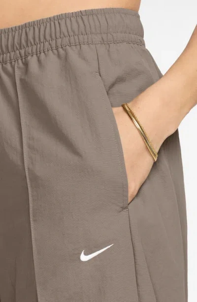 Nike Sportswear Everything Wovens Mid-rise Open-hem Pants In Brown