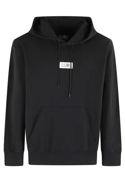 Mm6 Maison Margiela Mm6 By Maison Margiela Emblazoned Black Hoodie With Drawstring And Ribbed Finishes In Black