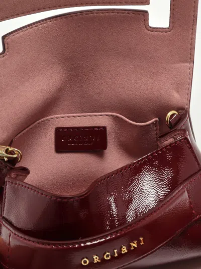 Orciani Gossip Xs Vinyl Clutch In Burgundy