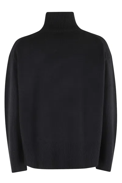 Vince Turtle Neck Side Slit Sweater In Black