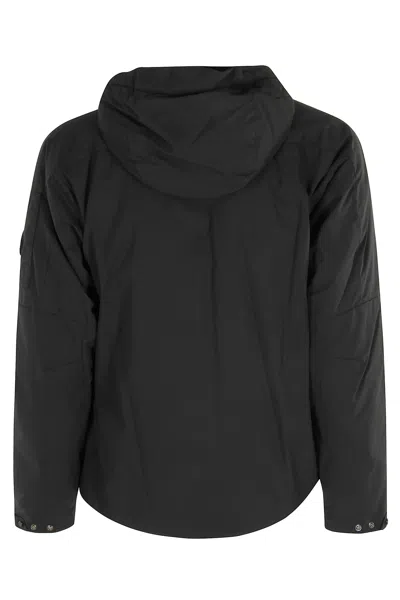 C.p. Company Sleek Black Medium Jacket With Adjustable Hood And Zippered Pockets In Black