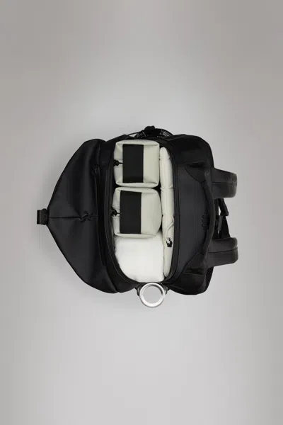 Rains Trail Clip Front Backpack In Black