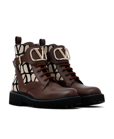 Valentino Logo-embossed Leather Combat Boots In Animal Print