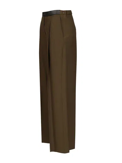 Loewe Logo Embossed Pleat Detail Trousers In Brown