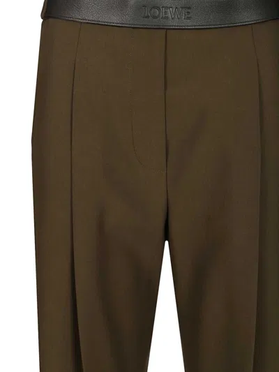 Loewe Logo Embossed Pleat Detail Trousers In Brown