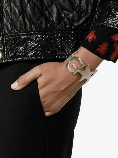 Shop Givenchy Logo And Star Cuff In Metallic
