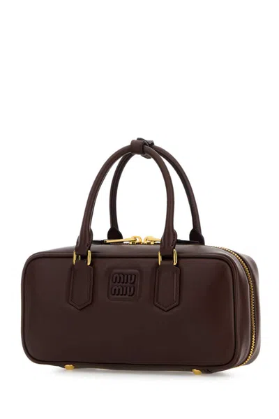 Miu Miu Handbags. In Burgundy