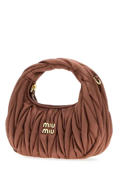 Miu Miu Handbags. In Brown