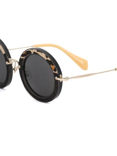 Shop Miu Miu Noir Round Sunglasses