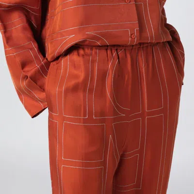 Totême Terracotta Silk Trousers With Monogram In Brown