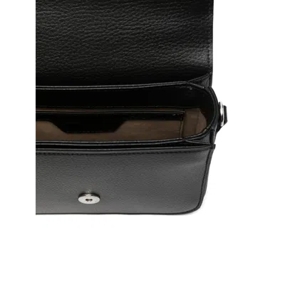 Stella Mccartney Logo-studded Mini Bag In Black