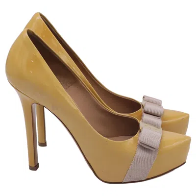 Ferragamo Vara Bow Platform Pumps In Yellow Patent Leather In Animal Print