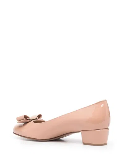 Ferragamo Round Toe Low Block Heel Patent Pumps In Neutral