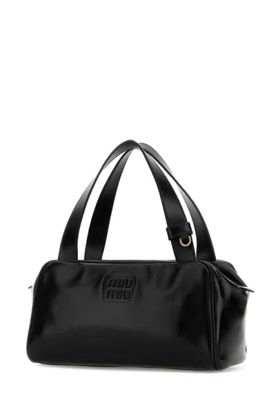 Miu Miu Handbags. In Black