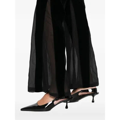 Never Fully Dressed Velvet Flared Trousers In Black
