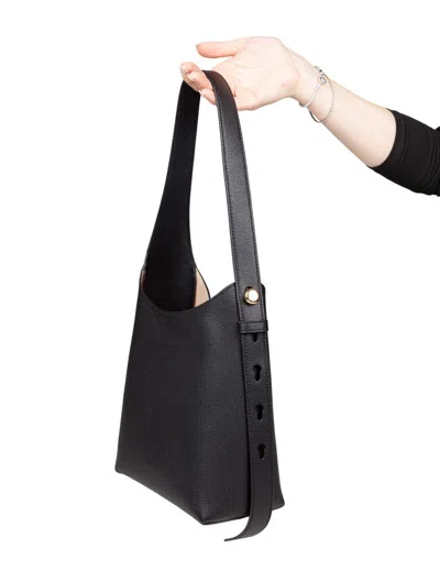 Tory Burch The Romy Small Hobo Bag Is Made Of Soft Hammered Leather In Black