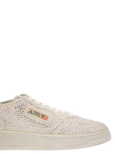 Autry Medalist Low Sneakers In Worn-out Effect Suede With Rhinestones In Neutral