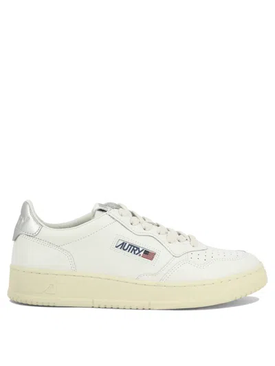Autry Low-top Sneakers With Contrast Sole And Perforated Detailing In White