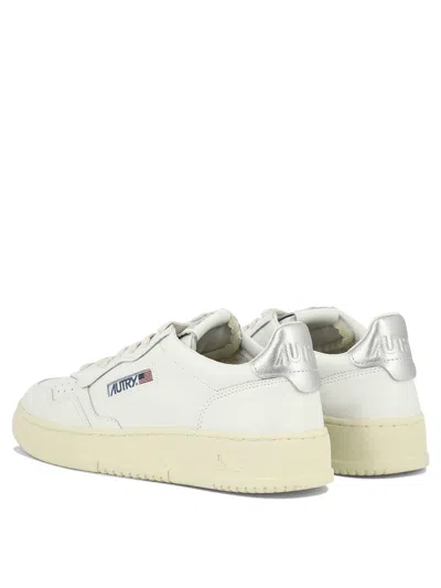 Autry Low-top Sneakers With Contrast Sole And Perforated Detailing In White