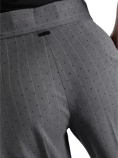 Gaëlle Pinstripe Embellished Trousers In Gray
