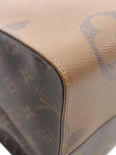 Pre-owned Louis Vuitton 2021 Monogram Reverse Giant Onthego Gm Satchel In Brown