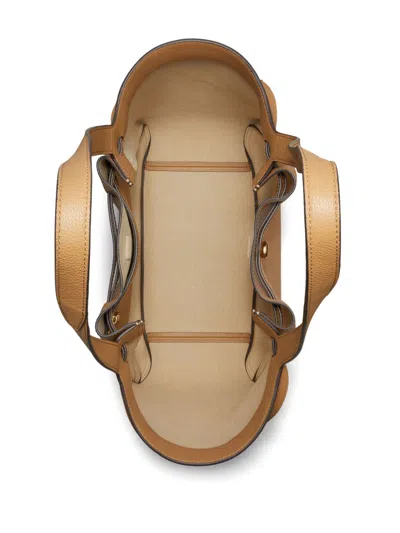 Tory Burch Jacquemus Ovalo Clutch In Tiramisu