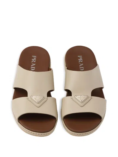 Prada Enameled Triangle Leather Slides In Neutral