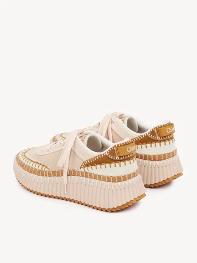 Chloé Low Top Sneakers Featuring Contrast Stitching And Textured Sole In Neutral
