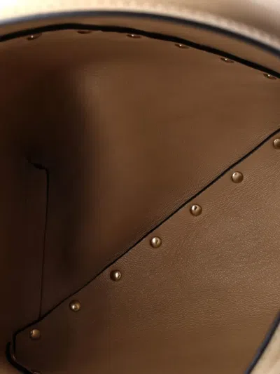 Pre-owned Valentino Garavani Rockstud Wispy Leather And Suede Small Bucket Bag In Neutral