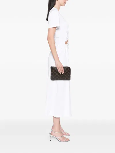 Pre-owned Louis Vuitton 2019 Monogram Etui Voyageur Pm Clutch Bag In Brown