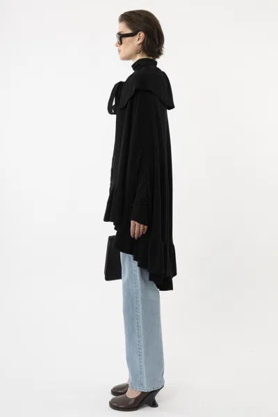 Arakii Knitted Ruffle Cape In Black
