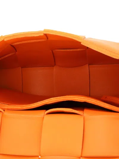 Pre-owned Bottega Veneta Cassette Maxi Intrecciato Leather Small Crossbody Bag In Orange