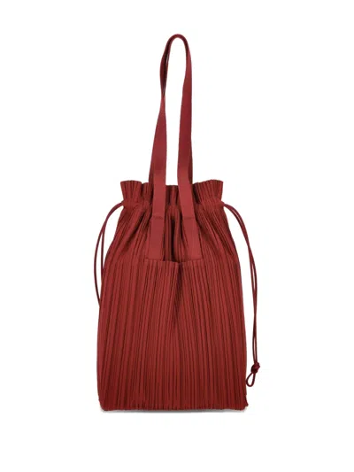 Issey Miyake Pleated Drawstring Tote Bag In Brown
