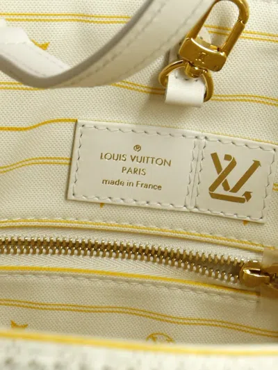 Pre-owned Louis Vuitton Onthego Limited Edition Cities Monogram Jacquard And Tuffetage Canvas Gm Tote Bag In Neutral