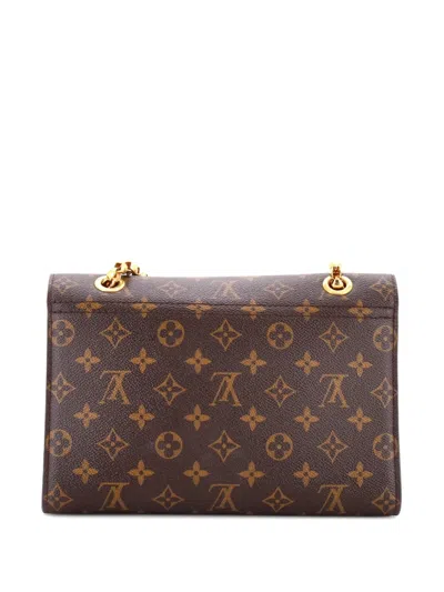 Pre-owned Louis Vuitton Victoire Handbag Monogram Canvas And Leather Shoulder Bag In Brown