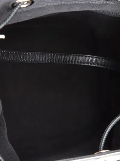 Pre-owned Chanel Drawstring Cc Flap Quilted Aged Calfskin And Grosgrain Small Backpack In Black