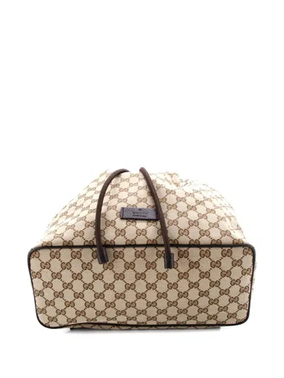 Pre-owned Gucci Drawstring Gg Canvas Medium Backpack In Brown