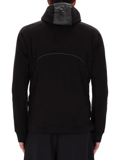 And Wander Alpha Air Jacket In Black