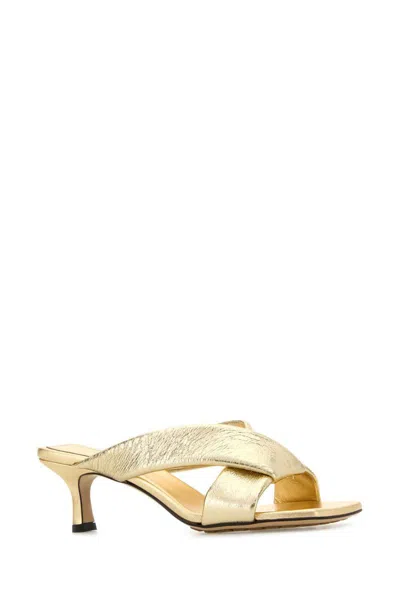 Bottega Veneta Metallic Cross Strap Open Toe Mules In Gold