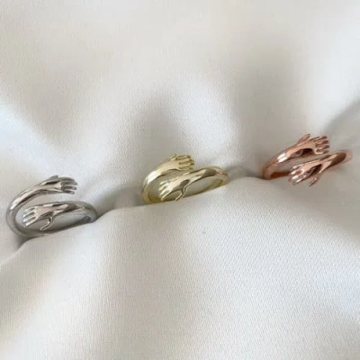 Spero London Hug Ring With Hands Sterling Silver And Gold Plated In Gold